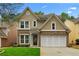 Charming two-story home featuring a brick and siding exterior with a well-manicured front lawn at 3119 Devauden Ct, Duluth, GA 30096