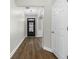 Inviting foyer with dark wood-look floors and a view of the glass-paneled front door at 3119 Devauden Ct, Duluth, GA 30096