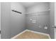 Laundry room featuring washer/dryer hookups and storage shelving at 3119 Devauden Ct, Duluth, GA 30096