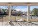 Inviting outdoor space showing a covered patio area with scenic views of the backyard and greenery at 4741 Covenant Way, Powder Springs, GA 30127