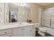Bathroom featuring a shower with glass doors and a vanity with a large mirror at 4741 Covenant Way, Powder Springs, GA 30127