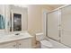 Clean bathroom featuring a single sink vanity, toilet, and shower-tub combination, offering convenience and functionality at 4741 Covenant Way, Powder Springs, GA 30127