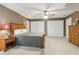 Large bedroom showcasing a ceiling fan, and closets and traditional furnishings at 4741 Covenant Way, Powder Springs, GA 30127