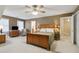 Spacious bedroom with a ceiling fan, hardwood furnishings, and generous natural light at 4741 Covenant Way, Powder Springs, GA 30127
