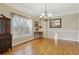 Traditional dining room with hardwood floors, chandelier, and ample natural light at 4741 Covenant Way, Powder Springs, GA 30127