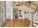 Grand foyer with hardwood floors, a curved staircase, and a view of the upper-level landing at 4741 Covenant Way, Powder Springs, GA 30127