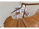 Elegant foyer view from the top of the staircase, showcasing a chandelier and entry door at 4741 Covenant Way, Powder Springs, GA 30127