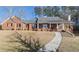Charming single-Gathering home with a brick facade, covered porch, and well-maintained landscaping at 4741 Covenant Way, Powder Springs, GA 30127