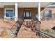 Inviting front porch with brick steps and decorative railings leading to the elegant front door at 4741 Covenant Way, Powder Springs, GA 30127