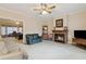 Inviting living area with a fireplace, comfortable seating, and neutral tones at 4741 Covenant Way, Powder Springs, GA 30127