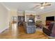 Spacious living room features hardwood floors, fireplace, and comfortable seating with access to foyer at 4741 Covenant Way, Powder Springs, GA 30127