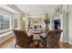 Cozy living room features a fireplace, large windows, and plush seating at 4741 Covenant Way, Powder Springs, GA 30127