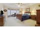 Spacious main bedroom with a bay window, desk, and ample natural light at 4741 Covenant Way, Powder Springs, GA 30127