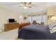 Serene main bedroom featuring large windows and a classic furniture set at 4741 Covenant Way, Powder Springs, GA 30127