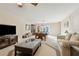Well-lit recreation room with a pool table, TV, and cozy sofas, perfect for gatherings and leisure activities at 4741 Covenant Way, Powder Springs, GA 30127
