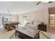 Relaxing recreation room featuring a pool table, comfortable sofa, and plenty of natural light, ideal for unwinding at 4741 Covenant Way, Powder Springs, GA 30127
