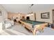 Spacious recreation room with a pool table, comfortable seating, and ample lighting, great for entertainment at 4741 Covenant Way, Powder Springs, GA 30127