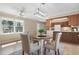 Bright dining area with views of the trees outside and close proximity to the kitchen at 103 Eubanks Ct, Woodstock, GA 30188