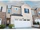 Attractive townhouse showcasing a blend of brick and gray siding accents at 1277 Sunny Lake Dr, Lawrenceville, GA 30043