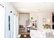 Cozy living room adjacent to a staircase, complete with a stylish bookcase at 1277 Sunny Lake Dr, Lawrenceville, GA 30043