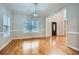 Spacious dining room with hardwood floors, large window, and elegant lighting at 2892 Orr Dr, Atlanta, GA 30344