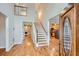 Inviting foyer boasts hardwood floors, staircase, and a view into the adjacent rooms at 2892 Orr Dr, Atlanta, GA 30344