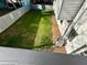 View of the manicured backyard featuring a lush lawn and wooden privacy fence at 295 Lamden Ct, Lawrenceville, GA 30046
