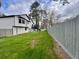 Fenced backyard with lush green grass, offering privacy and space for outdoor activities at 295 Lamden Ct, Lawrenceville, GA 30046