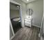 Bathroom with gray plank floors, a white vanity, and a modern shower at 295 Lamden Ct, Lawrenceville, GA 30046