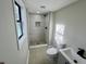Bathroom featuring a tiled shower, toilet and vanity at 295 Lamden Ct, Lawrenceville, GA 30046