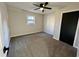 Bedroom with carpet, closet, and a ceiling fan at 295 Lamden Ct, Lawrenceville, GA 30046