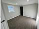 Carpeted bedroom featuring a light gray wall color and natural light at 295 Lamden Ct, Lawrenceville, GA 30046