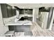 Modern kitchen with stainless steel appliances, marble countertops, and barstool seating at 295 Lamden Ct, Lawrenceville, GA 30046