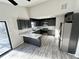 Bright kitchen with stainless steel appliances and a breakfast bar at 295 Lamden Ct, Lawrenceville, GA 30046