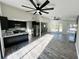 Bright, open-concept kitchen and living room with modern finishes and hardwood floors at 295 Lamden Ct, Lawrenceville, GA 30046