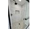 Modern shower with a pebble floor and gray and white tile at 295 Lamden Ct, Lawrenceville, GA 30046