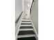 Stairs with gray walls and a white door at 295 Lamden Ct, Lawrenceville, GA 30046