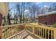The beautiful back deck has a scenic view of the backyard and the brick exterior of the house at 750 Parkway Se Dr, Smyrna, GA 30080