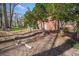 Brick home with blooming trees in the backyard and a small patio area at 750 Parkway Se Dr, Smyrna, GA 30080