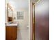 Bathroom featuring a pink sink, shower and white tile flooring at 750 Parkway Se Dr, Smyrna, GA 30080
