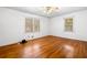 Spacious bedroom with hardwood floors, large windows providing natural light, and neutral wall paint at 750 Parkway Se Dr, Smyrna, GA 30080