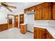 Bright kitchen with wood cabinets, modern white countertops, and tile flooring for a clean look at 750 Parkway Se Dr, Smyrna, GA 30080