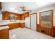 Traditional kitchen with wood paneled walls, white countertops, and ample natural light at 750 Parkway Se Dr, Smyrna, GA 30080