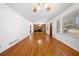 Bright living room featuring hardwood floors, stone fireplace, and neutral walls for versatile decor at 750 Parkway Se Dr, Smyrna, GA 30080