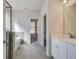 Bathroom featuring a soaking tub, walk-in shower, and modern fixtures at 209 Haverling Pass, Hampton, GA 30228