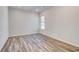 Bedroom showcasing modern flooring, natural light, and neutral walls at 209 Haverling Pass, Hampton, GA 30228