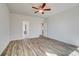 Spacious bedroom with an ensuite bath and modern flooring at 209 Haverling Pass, Hampton, GA 30228