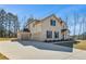 Attractive home featuring an attached three-car garage and long concrete driveway at 209 Haverling Pass, Hampton, GA 30228