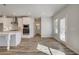 Modern kitchen and breakfast area with white cabinetry and stainless steel appliances at 209 Haverling Pass, Hampton, GA 30228