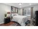 Comfortable bedroom with a plush bed, elegant decor, a window, and ample natural light at 64 Montre Nw Sq, Atlanta, GA 30327
